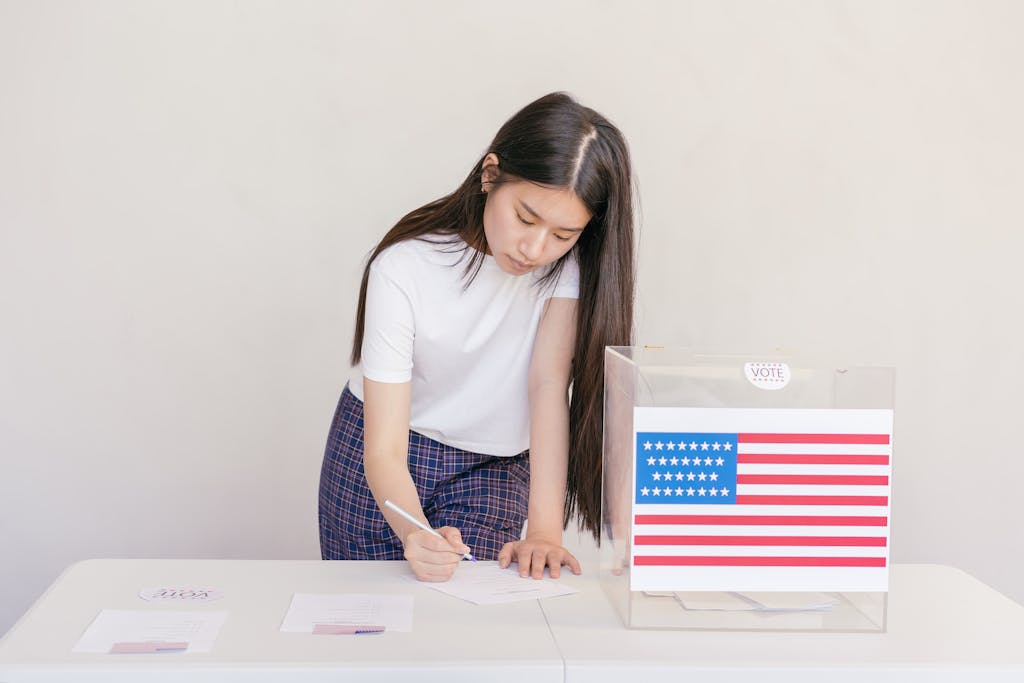 Woman voting in an election, writing down her choice at a ballot box with the American flag.